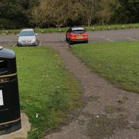 Take the first path left. This descends somewhat steeply to another car park.